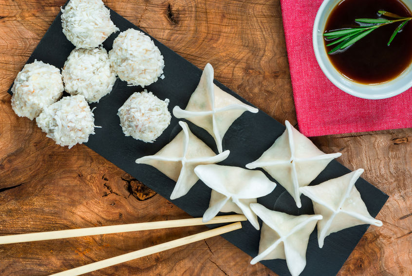 Dim sum - chinese chicken dumplings and coconut coated prawn snowballs with reach soy dip. Party food idea.