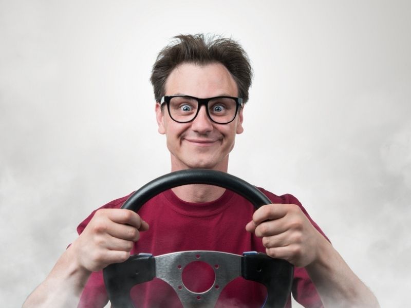 man holding a steering wheel